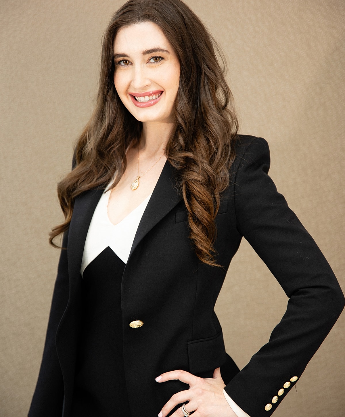 Portrait of a woman with curly hair.