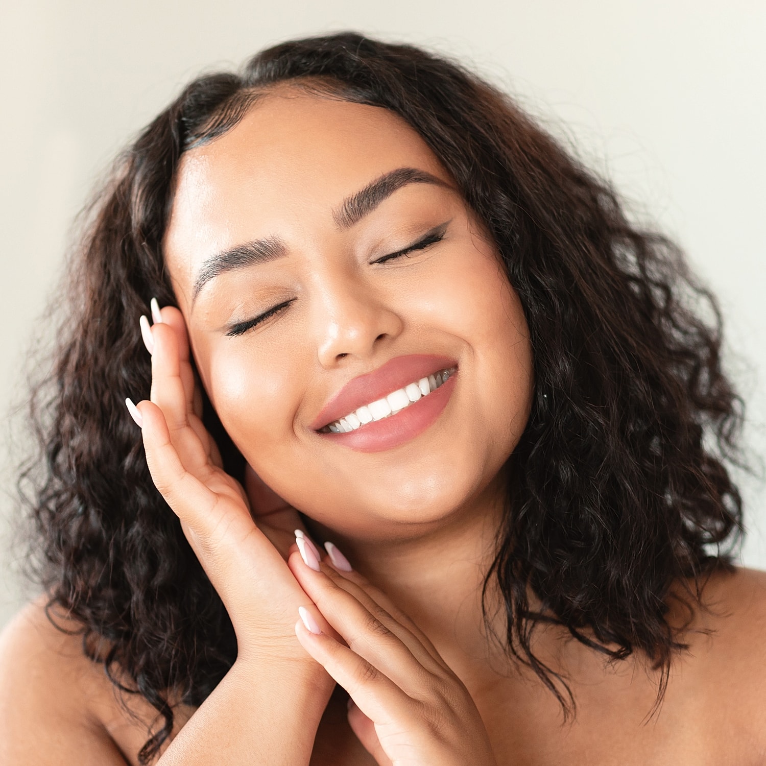 Portrait of a woman with long, flowing hair.